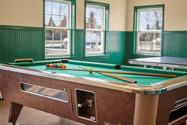 recreation room with billiards table and a wainscoted wall
