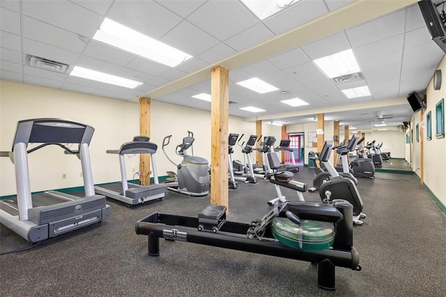 gym featuring a paneled ceiling
