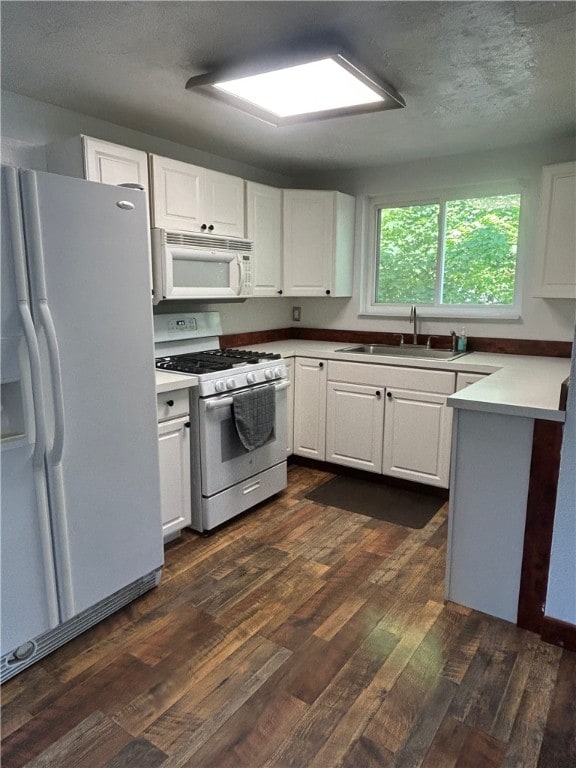 200 Burch Dr, Moon/Crescent Twp, PA 15108 - kitchen with white appliances, a sink, dark wood-style floors, and white cabinets