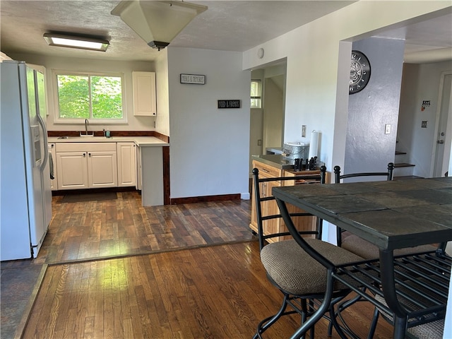 200 Burch Dr, Moon/Crescent Twp, PA 15108 - kitchen with white fridge with ice dispenser, a sink, dark wood-type flooring, and white cabinetry