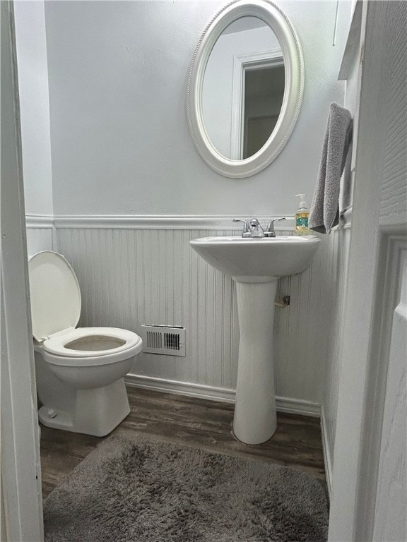 200 Burch Dr, Moon/Crescent Twp, PA 15108 - half bath featuring wainscoting, wood finished floors, and toilet