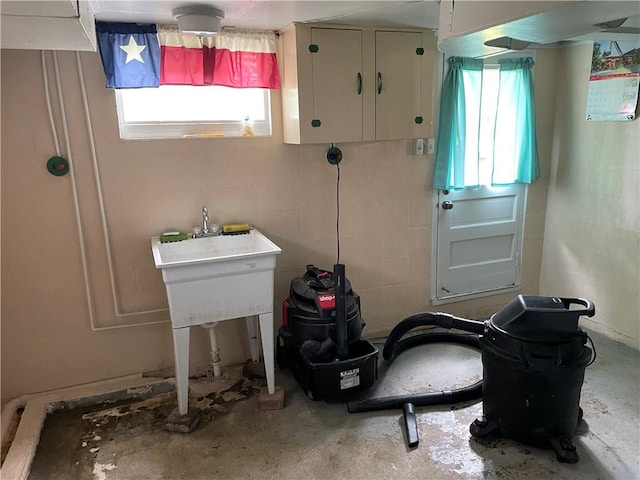 bathroom with unfinished concrete flooring
