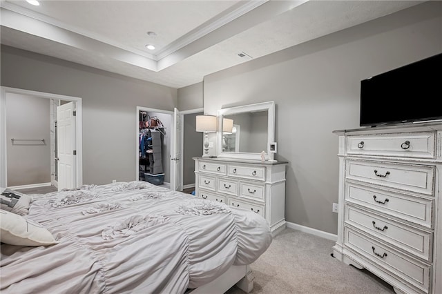 bedroom featuring crown molding, baseboards, light colored carpet, recessed lighting, and a tray ceiling