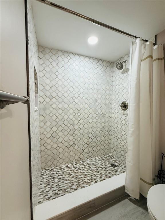 full bath featuring a shower stall, toilet, and recessed lighting