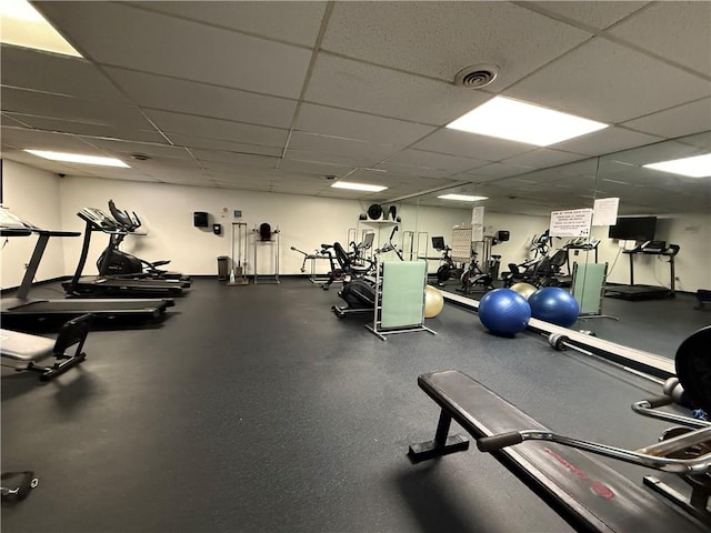gym featuring a drop ceiling