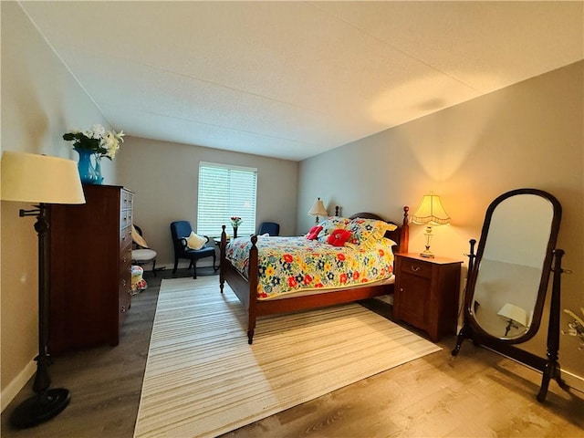 bedroom featuring wood finished floors