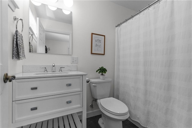 bathroom with toilet and vanity