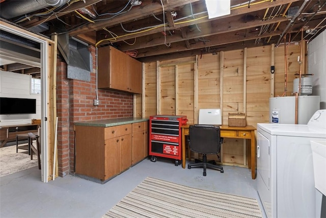 unfinished basement with washer / dryer, gas water heater, and wooden walls