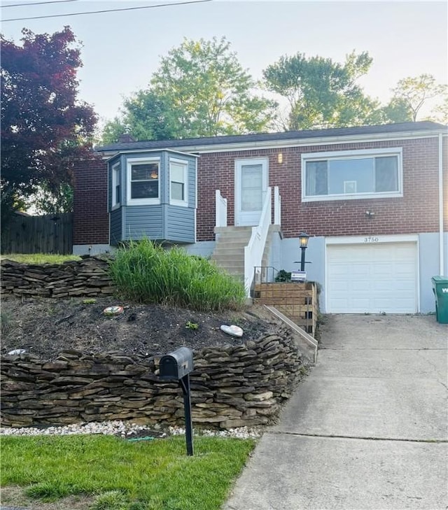 3750 Margate Rd, Churchill Boro, PA 15221 - single story home with a garage, driveway, brick siding, and fence