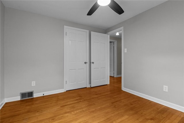 202 Pickwick Dr, Bethel Park, PA 15102 - unfurnished bedroom with light wood-style flooring, baseboards, and a ceiling fan