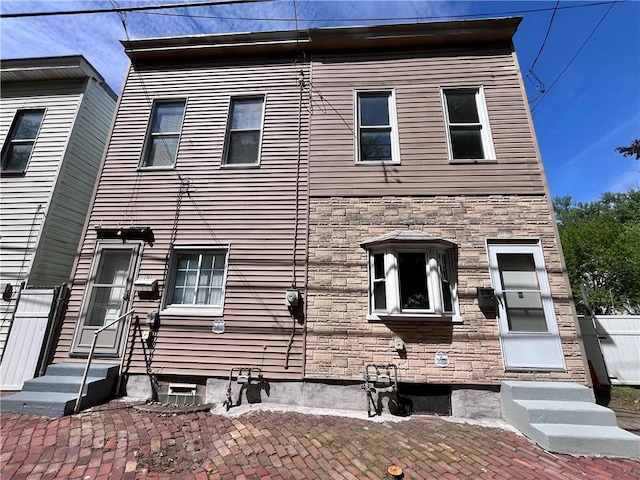 multi unit property with entry steps and stone siding