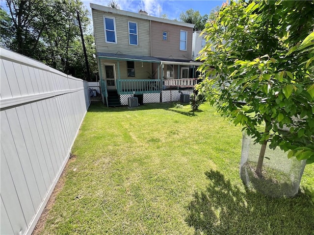 back of house featuring a deck and central air condition unit
