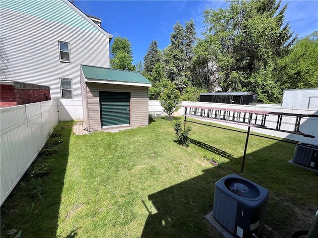 view of yard with central AC