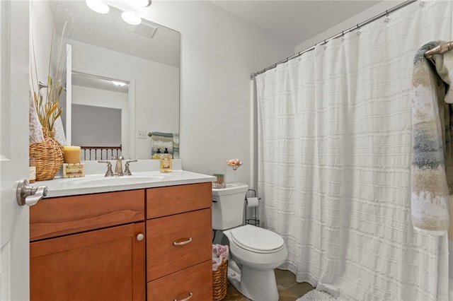 bathroom with vanity, toilet, a shower with curtain, and tile patterned floors