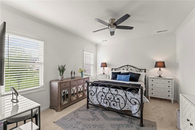 bedroom featuring light colored carpet, crown molding, a ceiling fan, and baseboards