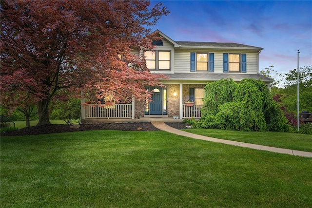 view of front of house featuring a porch and a front lawn