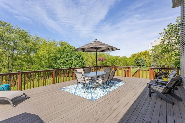 deck with outdoor dining area