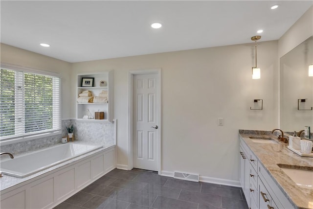 bathroom featuring baseboards, a garden tub, recessed lighting, tile patterned floors, and double vanity