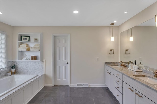 bathroom featuring tile patterned floors, a bath, recessed lighting, double vanity, and baseboards