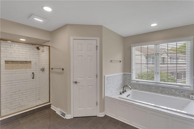 full bathroom with a bath, a stall shower, tile patterned flooring, recessed lighting, and baseboards