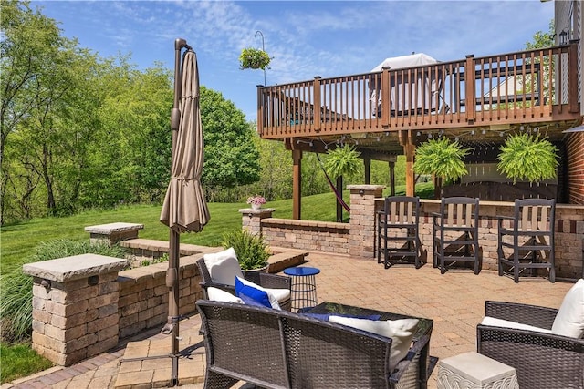 view of patio with a wooden deck and outdoor lounge area