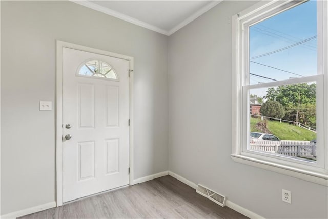 1017 Main St, Coraopolis, PA 15108 - foyer entrance featuring crown molding, wood finished floors, and baseboards