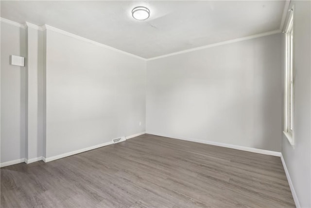 1017 Main St, Coraopolis, PA 15108 - spare room with ornamental molding, wood finished floors, and baseboards