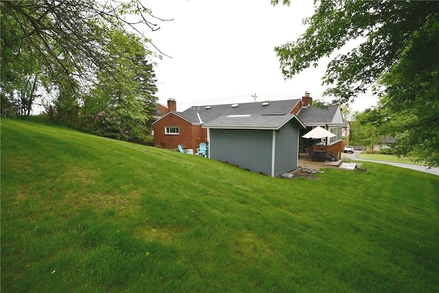 5005 Brownsville Rd, Whitehall, PA 15236 - rear view of property with a chimney, a yard, and an outdoor structure