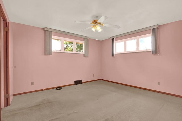 1409 Gill Hall Rd, Jefferson Hills, PA 15025 - spare room featuring light carpet, baseboards, and a ceiling fan
