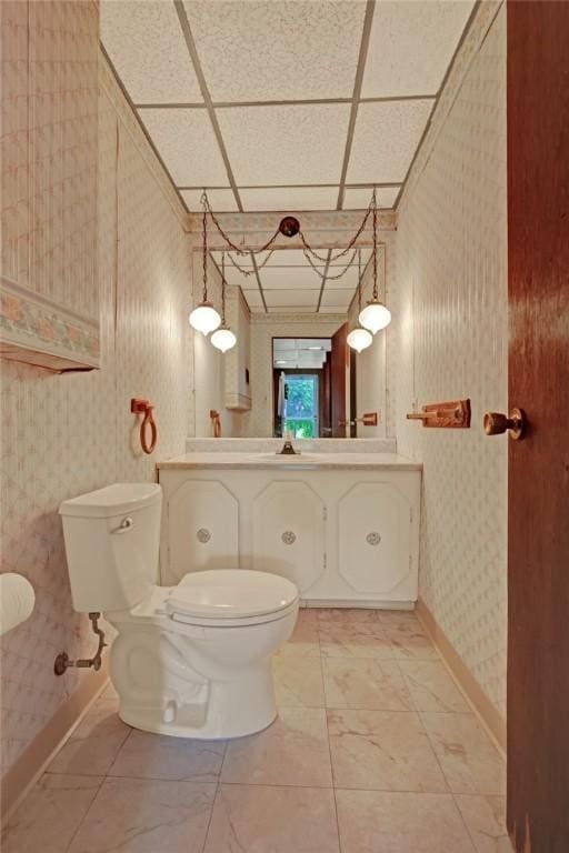 1409 Gill Hall Rd, Jefferson Hills, PA 15025 - bathroom with toilet, baseboards, wallpapered walls, and vanity