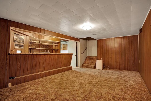 1409 Gill Hall Rd, Jefferson Hills, PA 15025 - additional living space with wood walls, carpet floors, and stairway