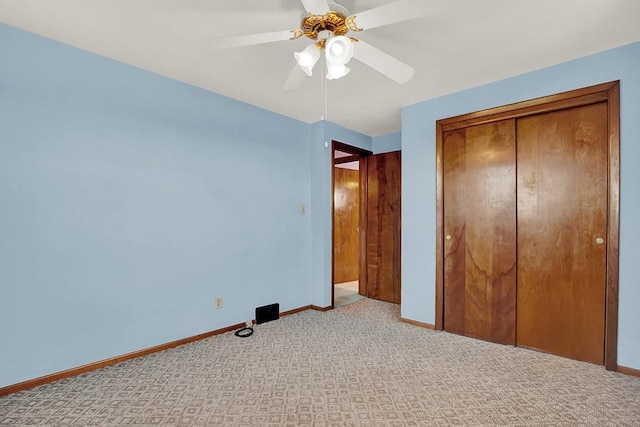 1409 Gill Hall Rd, Jefferson Hills, PA 15025 - unfurnished bedroom with carpet floors, baseboards, a closet, and a ceiling fan