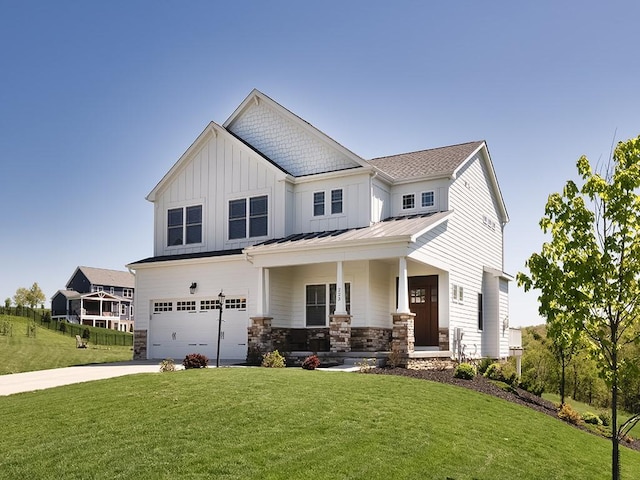 view of front of property featuring board and batten siding, an attached garage, a porch, driveway, and a front lawn