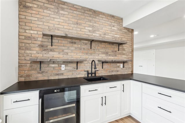 indoor wet bar with wine cooler and recessed lighting