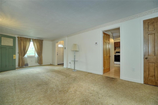 338 Elizabeth Ave, Chalfant Boro, PA 15112 - unfurnished living room with arched walkways, carpet flooring, ornamental molding, and baseboards