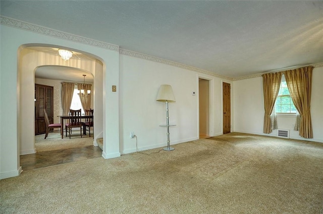 338 Elizabeth Ave, Chalfant Boro, PA 15112 - unfurnished room with arched walkways, a chandelier, carpet, and baseboards