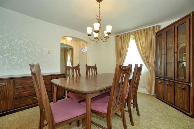 338 Elizabeth Ave, Chalfant Boro, PA 15112 - dining space with arched walkways, light carpet, and a chandelier