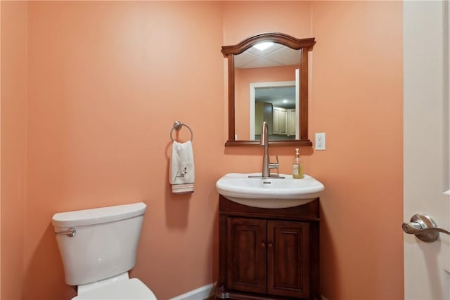 half bath with toilet and vanity