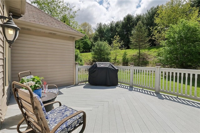 wooden terrace with a grill