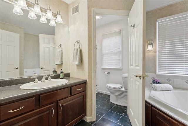 bathroom with tile patterned flooring, toilet, vanity, a bath, and baseboards
