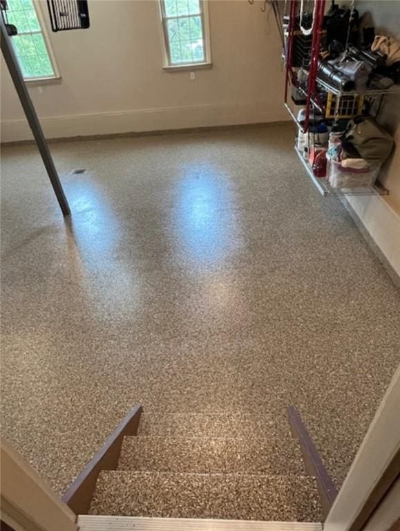 below grade area featuring plenty of natural light and baseboards
