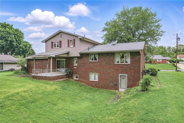 1807 Memorial, Farrell, PA 16121 - rear view of property with brick siding, a lawn, and roof with shingles
