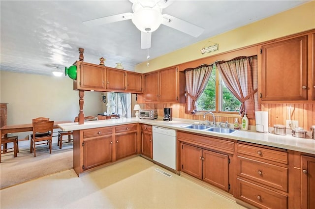 1807 Memorial, Farrell, PA 16121 - kitchen with white dishwasher, a sink, brown cabinetry, and light countertops