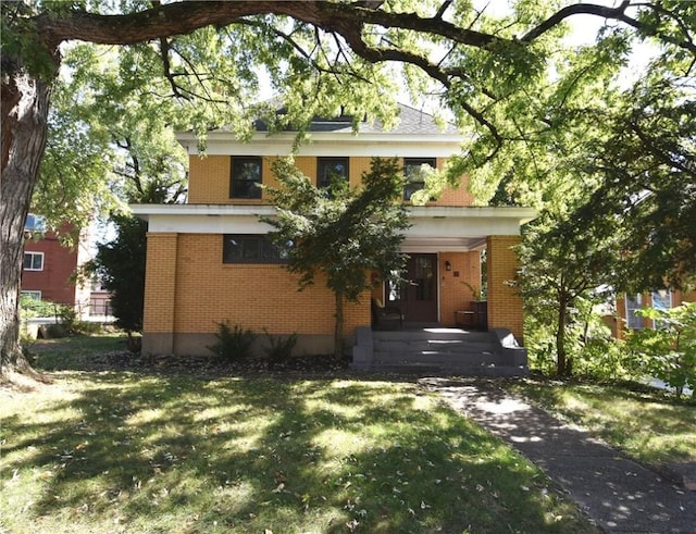 21 Hillson Ave, Brentwood, PA 15227 - view of front of property with brick siding, a front lawn, and covered porch