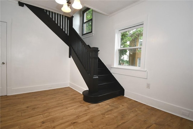 21 Hillson Ave, Brentwood, PA 15227 - staircase featuring ornamental molding, baseboards, wood finished floors, and a chandelier