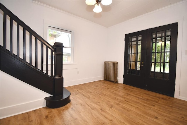 21 Hillson Ave, Brentwood, PA 15227 - foyer featuring radiator, ornamental molding, stairway, baseboards, and wood finished floors