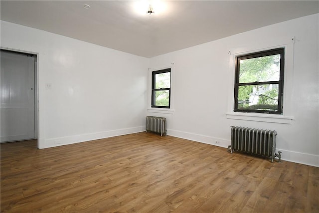 21 Hillson Ave, Brentwood, PA 15227 - spare room featuring radiator, wood finished floors, and baseboards