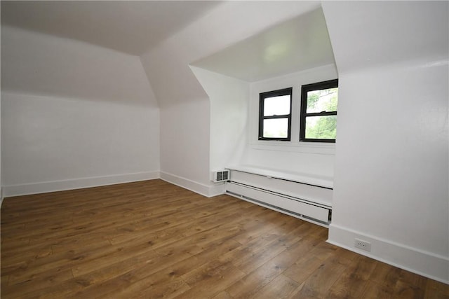21 Hillson Ave, Brentwood, PA 15227 - bonus room featuring a baseboard radiator, hardwood / wood-style flooring, lofted ceiling, and baseboards