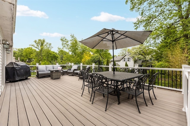 wooden deck with area for grilling, outdoor lounge area, and outdoor dining space