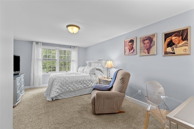 bedroom featuring carpet flooring and baseboards